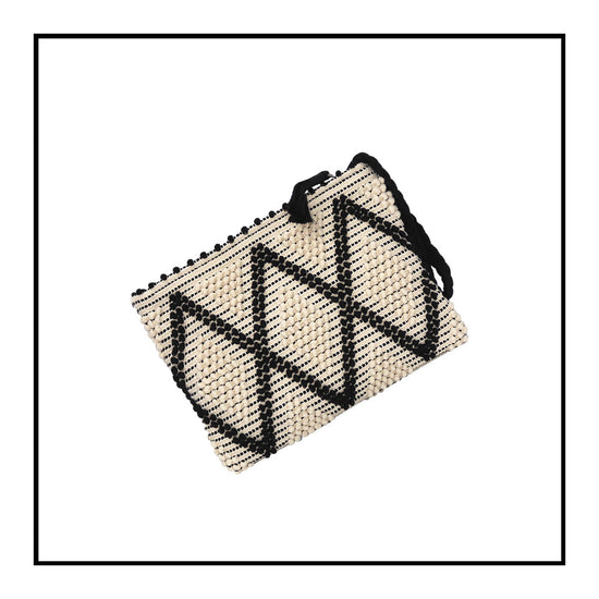 Front view of piattina zip clutch bag in black and white Best eco luxury bags and accessories brand. Stylish clothes and Eco-Friendly with recycled yarns #luxury #ecoconcious #sustainablestyle #ethicalbrands #ecoliving #ecofashion #ecostyle #ethicalhandbags #handbags