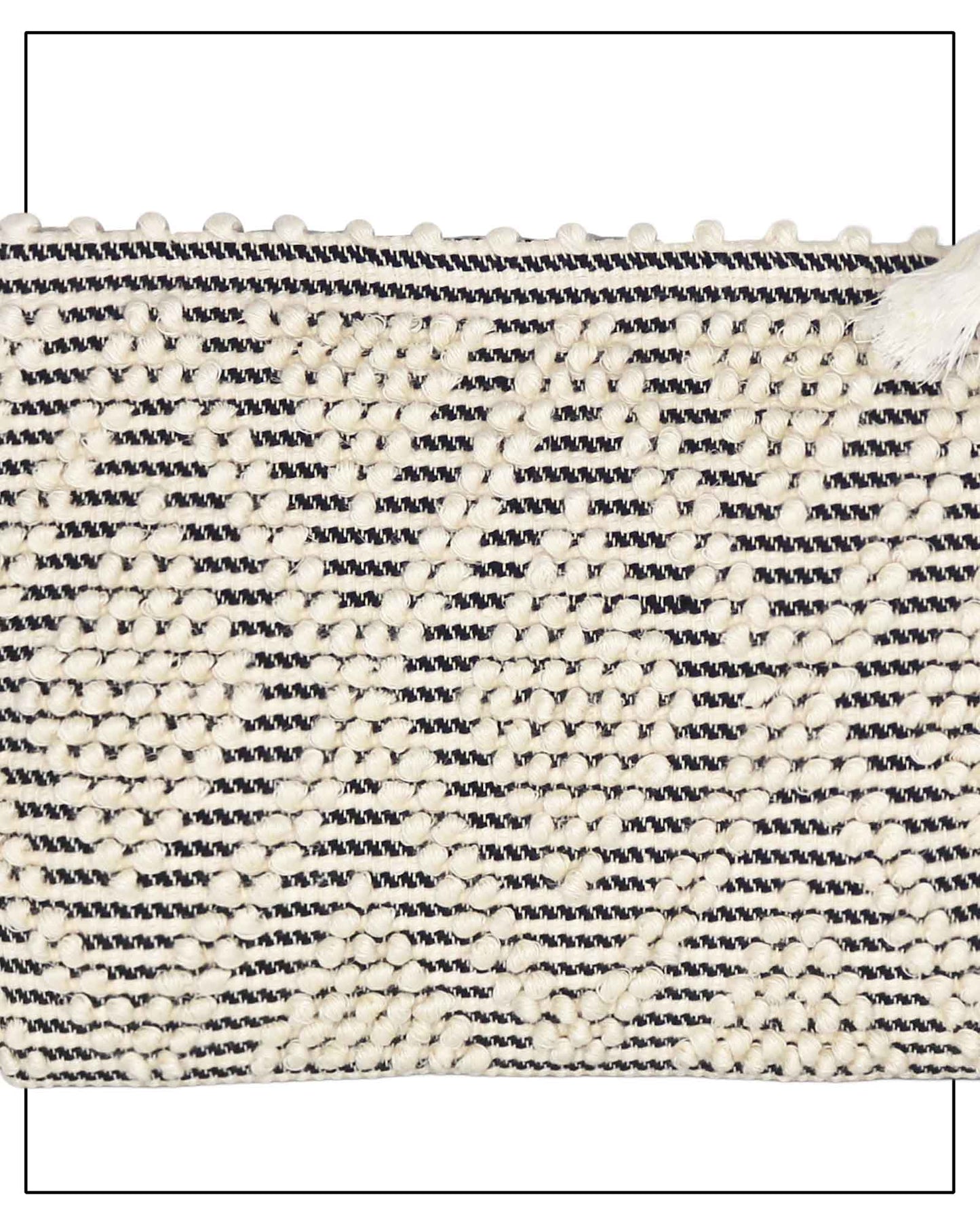 Antonello Tedde Hand-woven clutch bag with black and white pattern on a white background - detail view