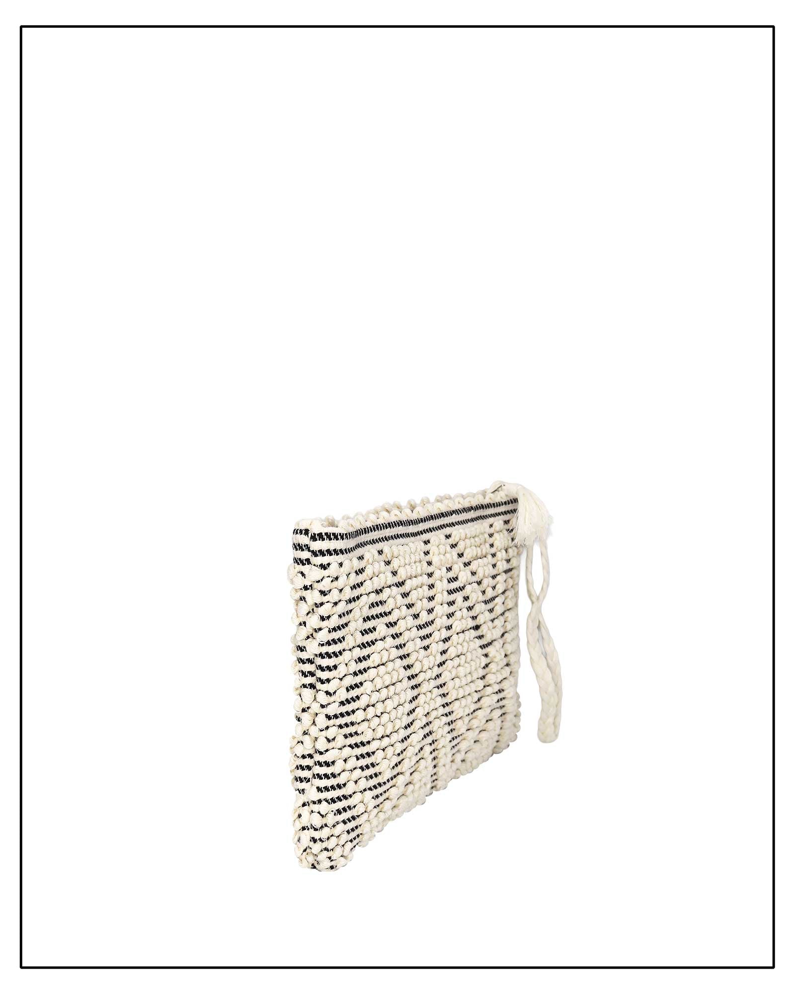 Antonello Tedde Hand-woven clutch bag with black and white pattern on a white background - side view