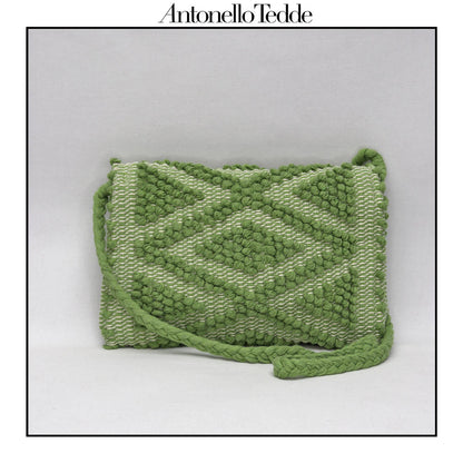 Back view of the green ground beloved style within the Antonello Tedde collection, the Suni Rombi Clutch cross-body.   The bag is celebrated for its effortless blend of elegance, function, and sustainable craftsmanship.