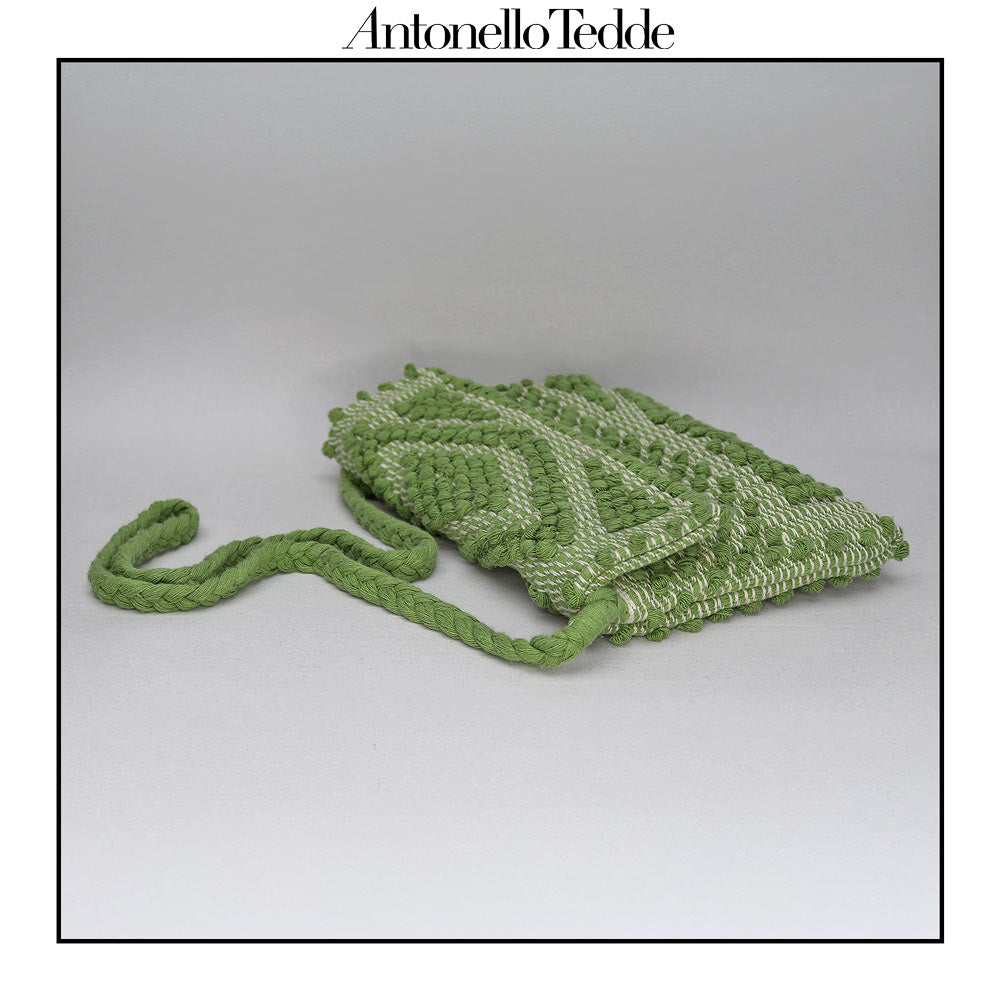 Top view of the green ground beloved style within the Antonello Tedde collection, the Suni Rombi Clutch cross-body.   The bag is celebrated for its effortless blend of elegance, function, and sustainable craftsmanship.