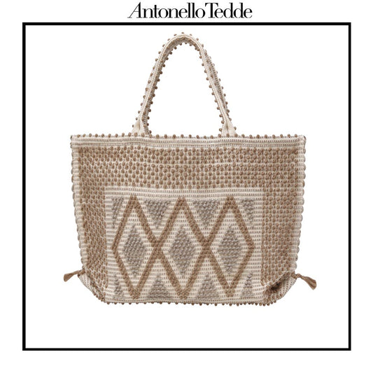 Front view of the Capriccioli Large Tote Bag, a best-seller in our collection, embodies timeless elegance and sustainable craftsmanship. Drawing inspiration from the serene beauty of Capriccioli Beach in Costa Smeralda, this versatile bag transitions effortlessly between seasons, making it perfect for city life and beach getaways.