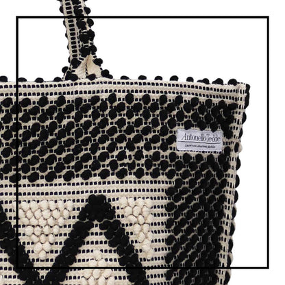 Detail view front handbag - Sustainable tote - summer bag - luxury handbag - handwoven black and white tote made in Italy by hand • timeless individualistic fashion • eco-friendly fashion • socially responsible, lasting fashion