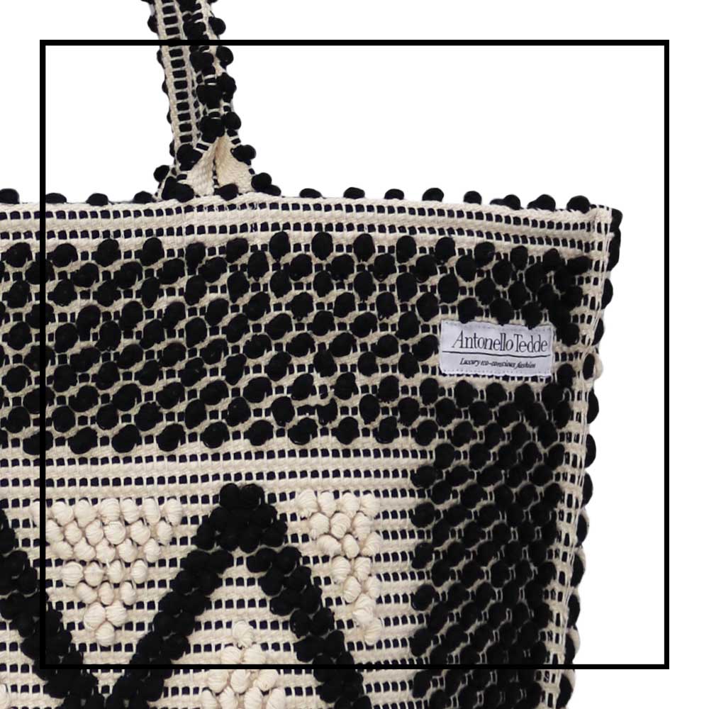 Detail view front handbag - Sustainable tote - summer bag - luxury handbag - handwoven black and white tote made in Italy by hand • timeless individualistic fashion • eco-friendly fashion • socially responsible, lasting fashion