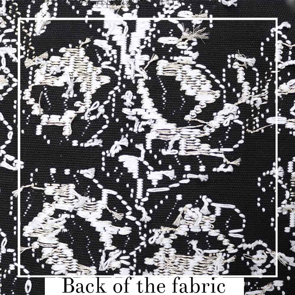 back of the fabric view showing the knots for  black and white evening bag to complete your look with our selection of accessories crafted with the environment in mind