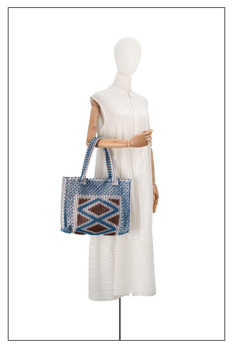 ON MODEL FULL VIEW FOR PROPORTIONS VIEW OF CHOC and DENIM medium tote bag  to complete your look with our selection of accessories crafted with the environment in mind
