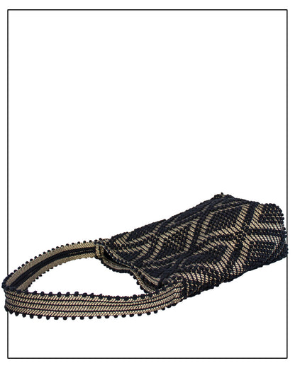 Flat view of an Antonello Tedde Bultei Rombi shoulder bucket bag, handwoven in Sardinia from black cotton with a shimmering golden viscose diamond pattern. 