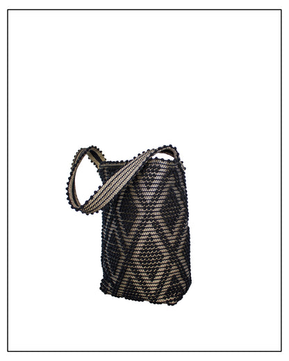 Antonello Tedde Bultei Rombi shoulder bucket bag, handwoven in Sardinia from black cotton with a shimmering golden viscose diamond pattern. 
