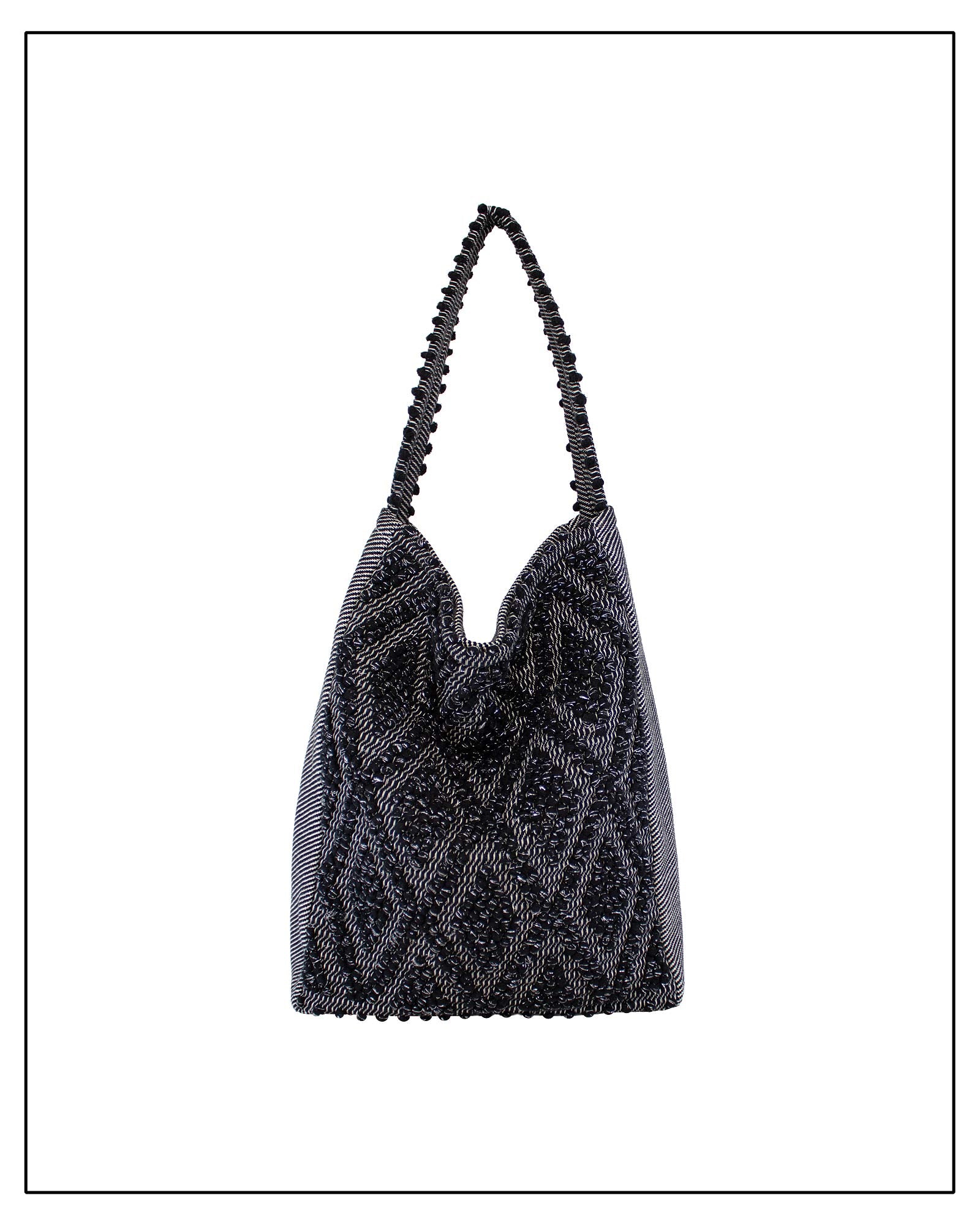 Front view of Antonello Tedde Bultei handwoven tote bag in black cotton with subtle silver highlights and textured woven front panel, handcrafted in Sardinia.
