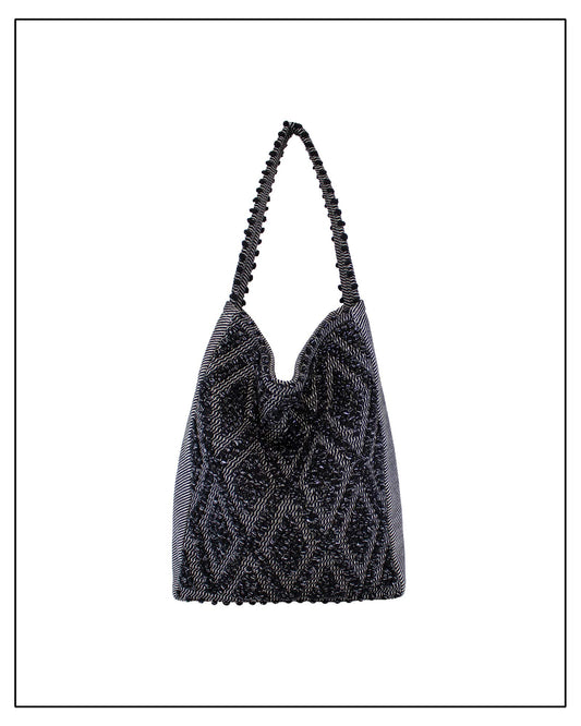 Front view of Antonello Tedde Bultei handwoven tote bag in black cotton with subtle silver highlights and textured woven front panel, handcrafted in Sardinia.