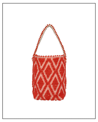 Front view of Antonello Tedde Bultei tote bag handwoven in Sardinia from 100% REACH-compliant cotton in coral and cream with raised geometric woven texture.
