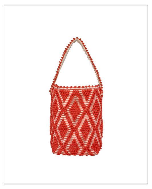 Front view of Antonello Tedde Bultei tote bag handwoven in Sardinia from 100% REACH-compliant cotton in coral and cream with raised geometric woven texture.