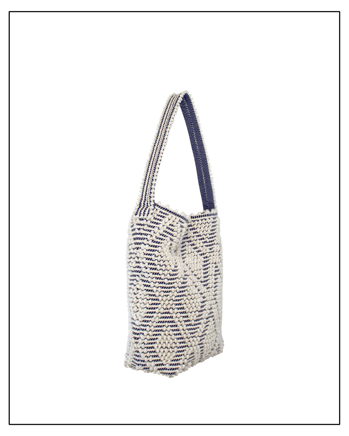 Side view of Antonello Tedde Bultei tote bag, handwoven in Sardinia from Italian linen and cotton in cream and blue with timeless artisan craftsmanship.