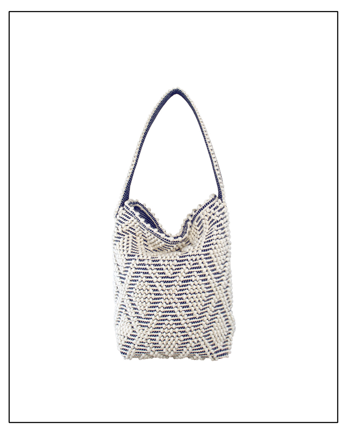 Front view with fold of Antonello Tedde Bultei tote bag, handwoven in Sardinia from Italian linen and cotton in cream and blue with timeless artisan craftsmanship.