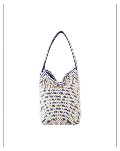 Front view with fold of Antonello Tedde Bultei tote bag, handwoven in Sardinia from Italian linen and cotton in cream and blue with timeless artisan craftsmanship.