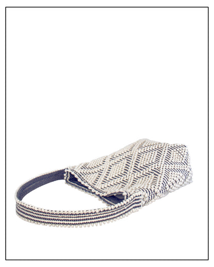 Flat view of Antonello Tedde Bultei tote bag, handwoven in Sardinia from Italian linen and cotton in cream and blue with timeless artisan craftsmanship.