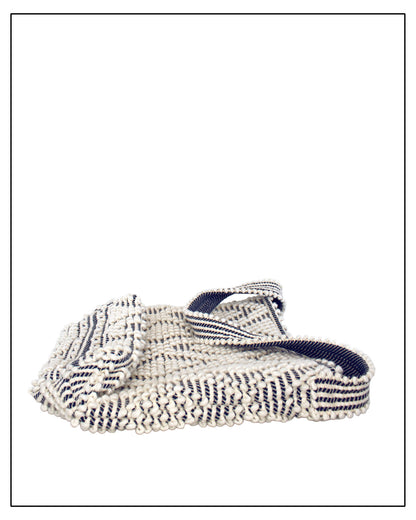 Folded view of Antonello Tedde Bultei tote bag, handwoven in Sardinia from Italian linen and cotton in cream and blue with timeless artisan craftsmanship.