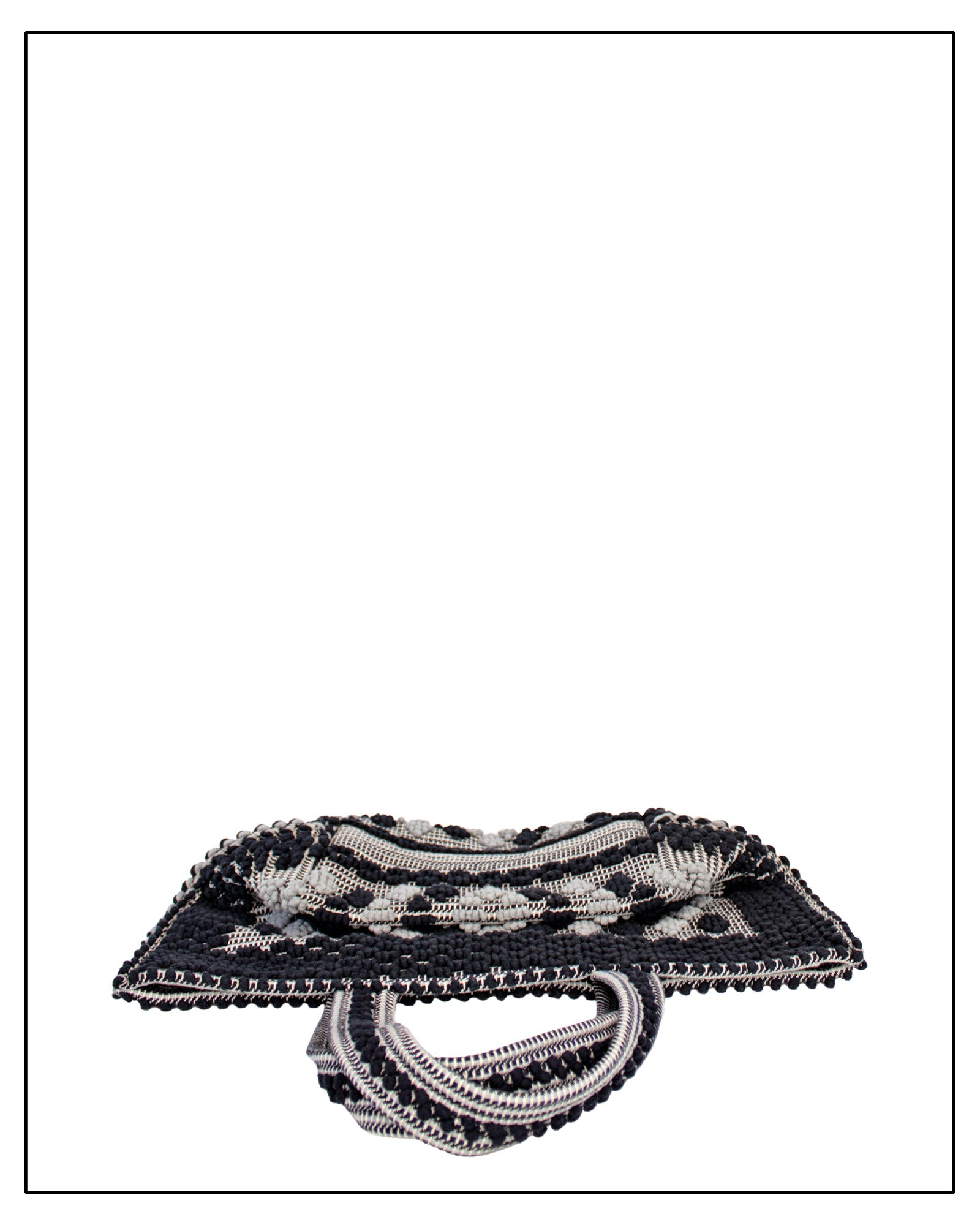 Flat folded view of Antonello Tedde Capriccioli Large handwoven cotton tote bag in black and grey with Rombetti small diamond pattern. 
