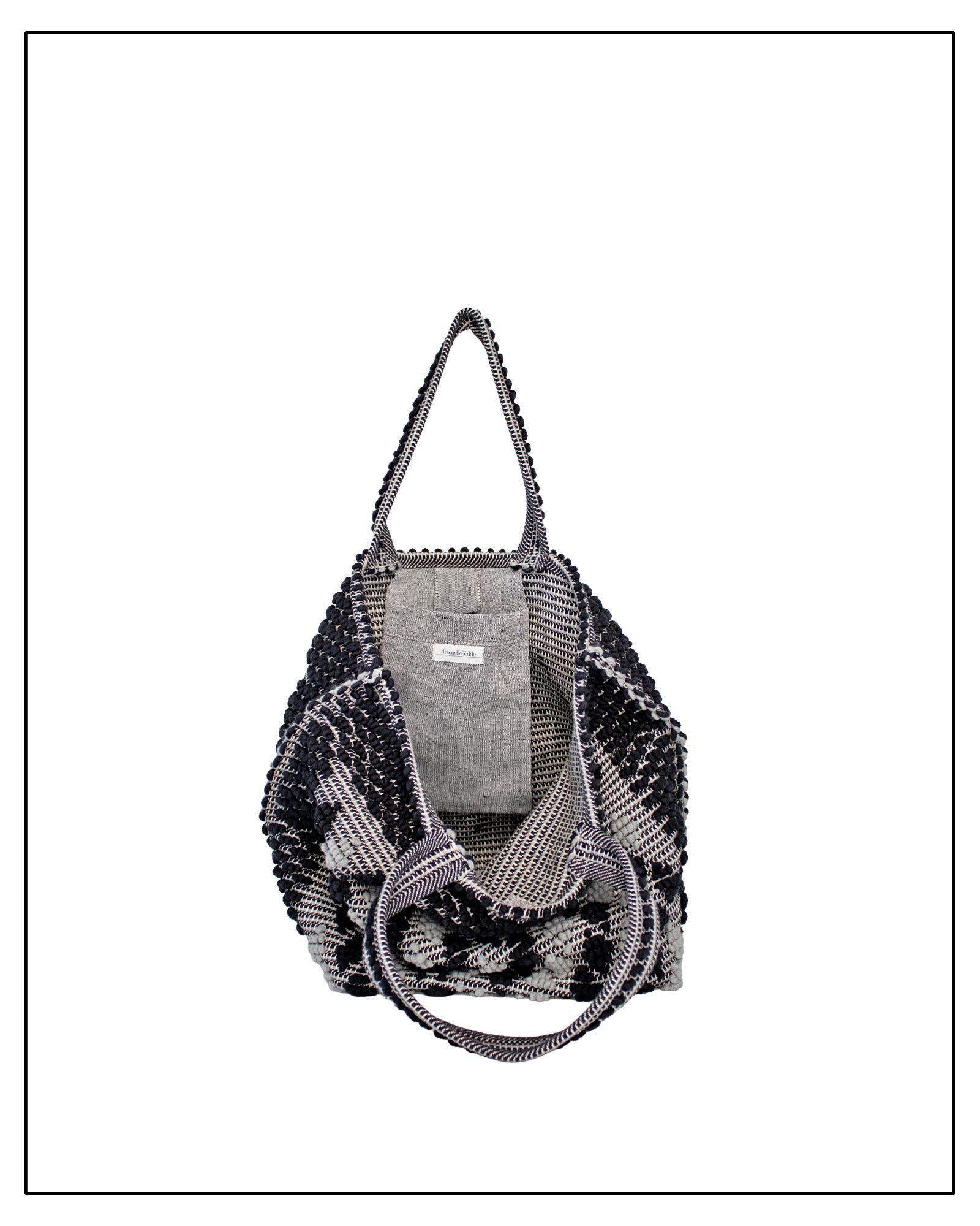 Pocket view of Antonello Tedde Capriccioli Large handwoven cotton tote bag in black and grey with Rombetti small diamond pattern.