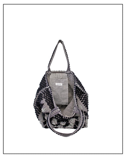 Pocket view of Antonello Tedde Capriccioli Large handwoven cotton tote bag in black and grey with Rombetti small diamond pattern.