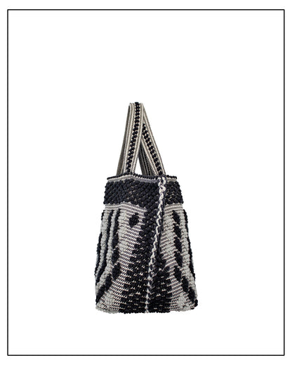 Side view two of Antonello Tedde Capriccioli Large handwoven cotton tote bag in black and grey with Rombetti small diamond pattern.
