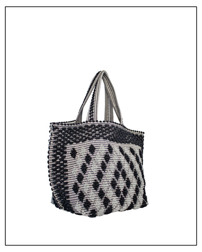 Side view of Antonello Tedde Capriccioli Large handwoven cotton tote bag in black and grey with Rombetti small diamond pattern.