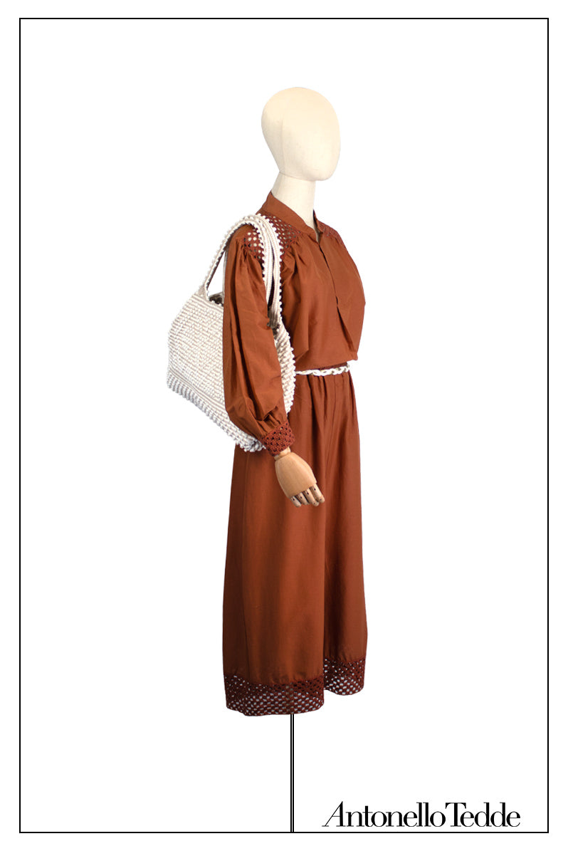Mannequin wearing a brown dress with a white bag on a white background, featuring the brand 'Antonello Tedde'. Medium tote bag cream base chestnut Ethical and Sustainable Handbags.  