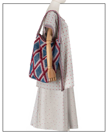 Antonello Tedde BAG ON MODEL BURGUNDY and DENIM/base CREAM bucket bag to complete your look with our selection of accessories crafted with the environment in mind