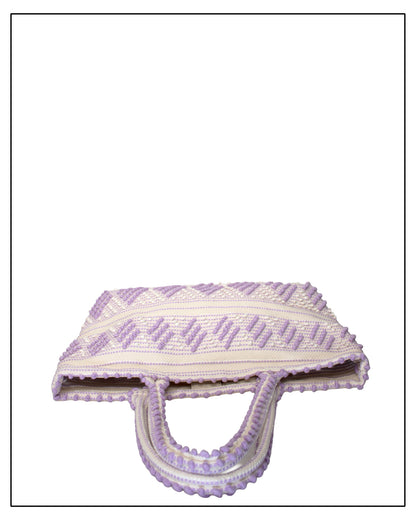 Antonello Tedde Mugoni Zig Zag Tote Bag, handwoven in Sardinia from linen and cotton with geometric zig zag weave and diamond motifs -  top view of tote bag with purple on a cream background