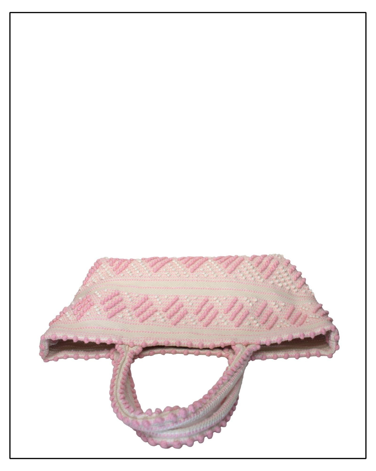Antonello Tedde Mugoni Zig Zag Tote Bag, handwoven in Sardinia from linen and cotton with geometric zig zag weave and diamond motifs - top view of tote bag with pink on a cream background