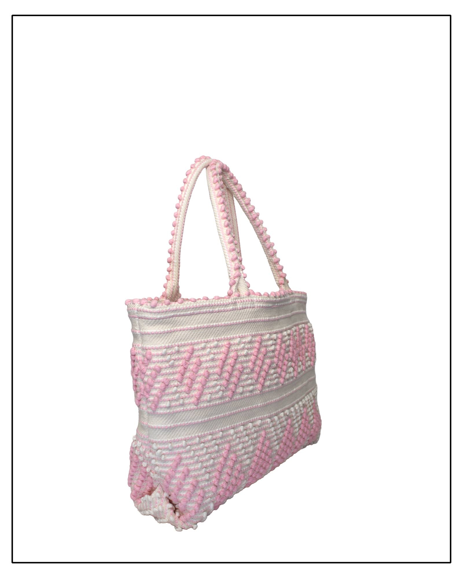 Antonello Tedde Mugoni Zig Zag Tote Bag, handwoven in Sardinia from linen and cotton with geometric zig zag weave and diamond motifs - side view of tote bag with pink on a cream background