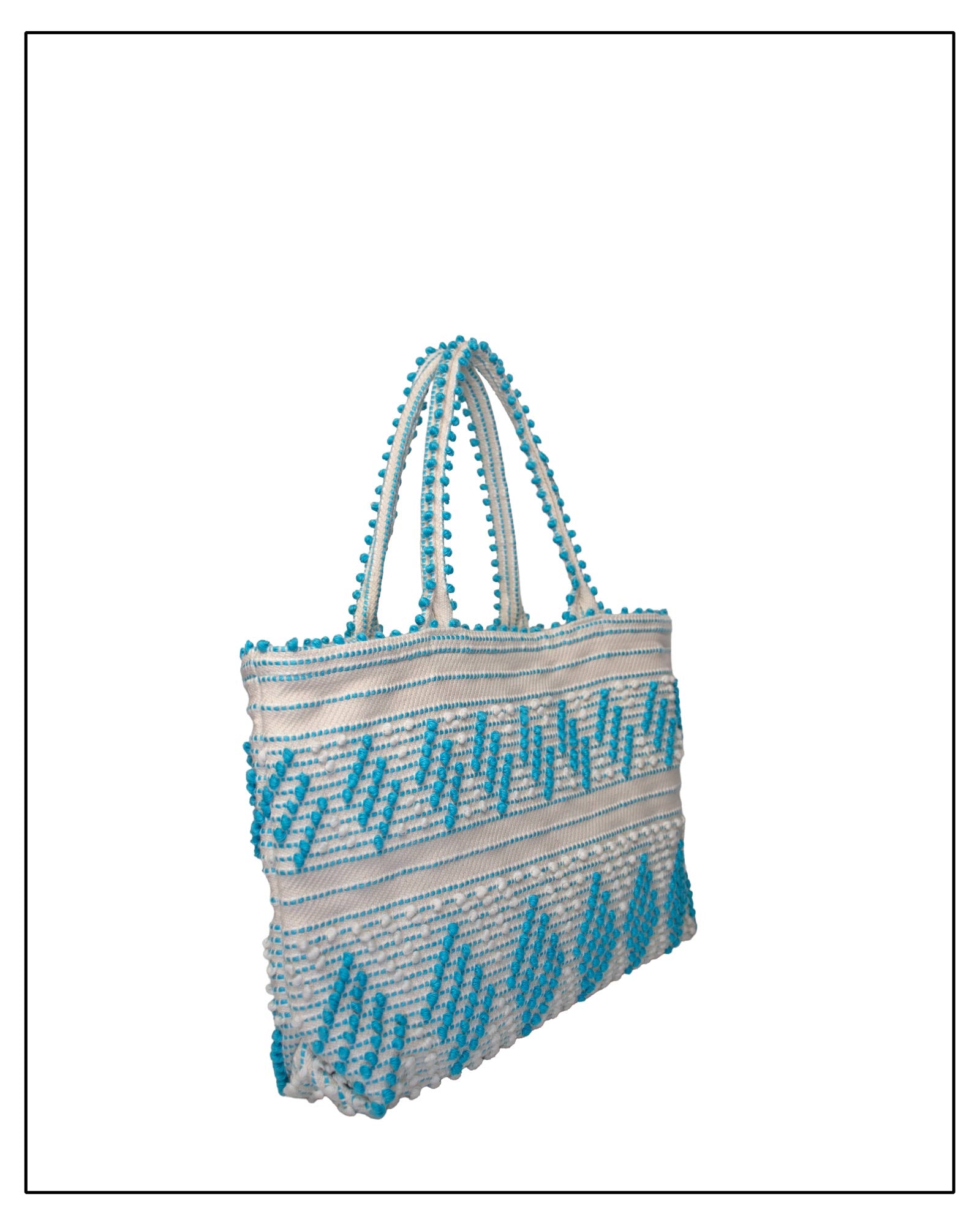 Antonello Tedde Mugoni Zig Zag Tote Bag, handwoven in Sardinia from linen and cotton with geometric zig zag weave and diamond motifs - Side view of tote bag with turquoise on a cream background