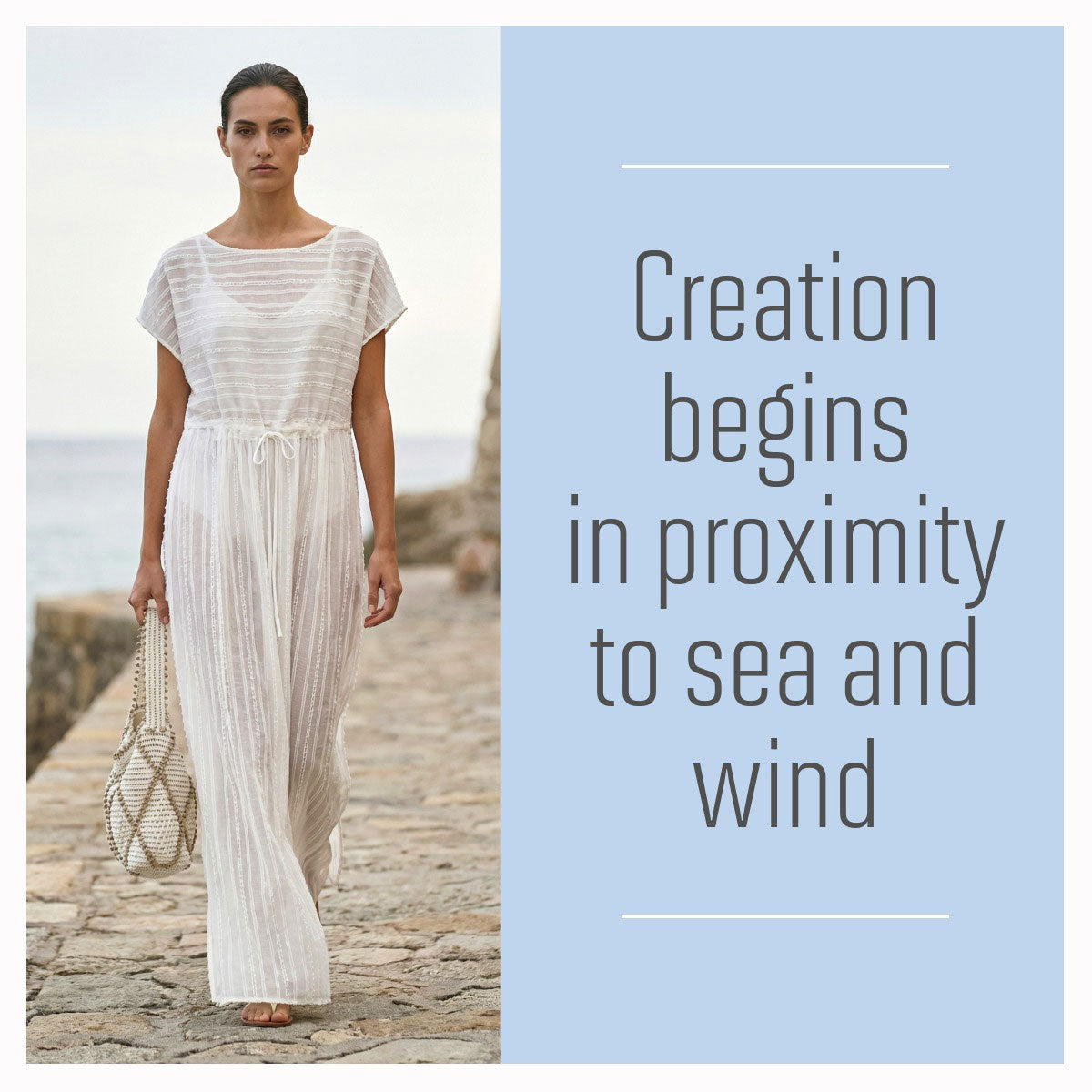 Model in a white dress carrying an Antonello Tedde handwoven sustainable bag on a Sardinian beach at sunset, walking on a stone path by the sea with a quote about creation. 