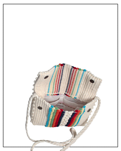 Lining and insided view of an Antonello Tedde Suni Arco crossbody bag handwoven in Sardinia in cream linen and cotton with colourful raised stripes and braided shoulder strap.