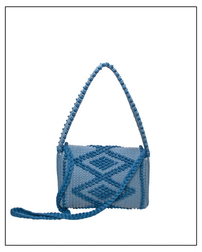 Back view of Antonello Tedde Suni X crossbody bag handwoven in Sardinia from denim blue, grey and cream cotton with raised rombi pattern and braided shoulder strap