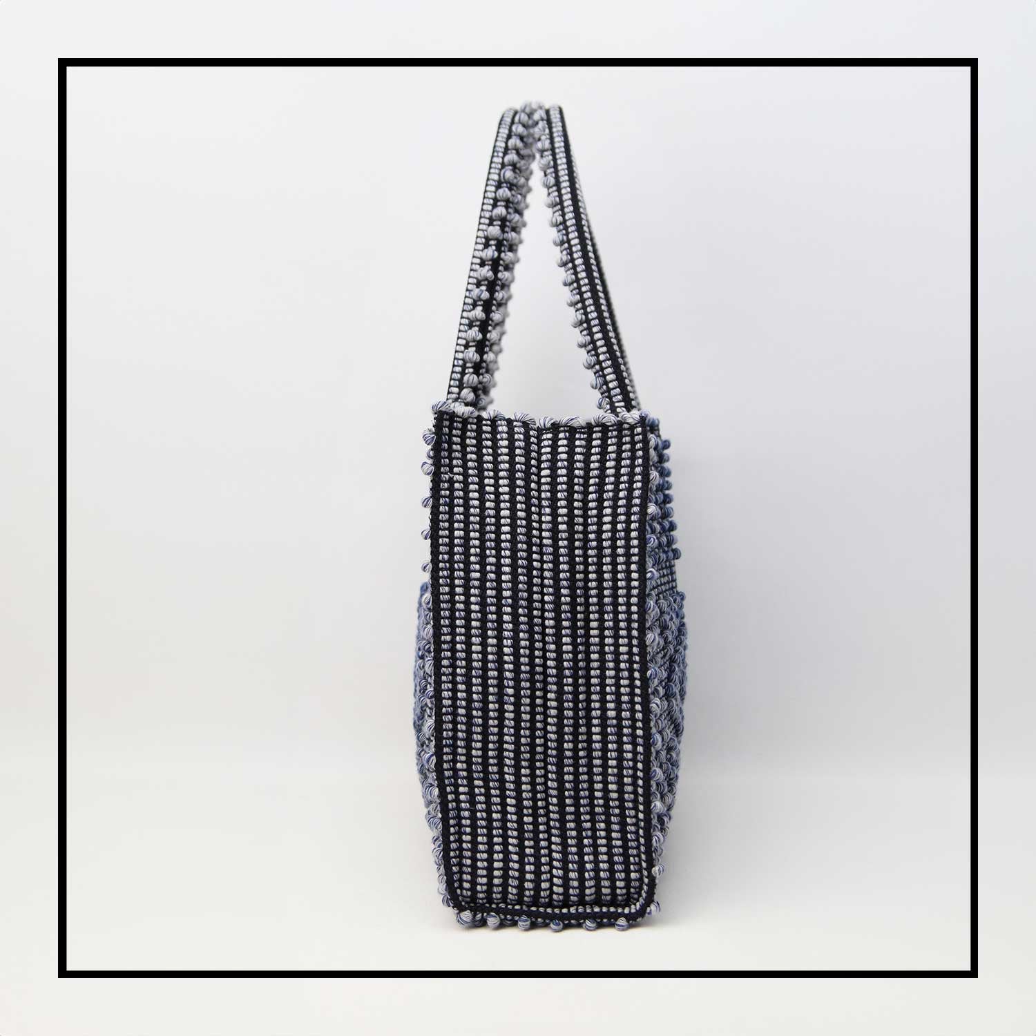 SIDE VIEW OF MELANGE BLUE with BLACK GROUND SQUARE TOTE bag to complete your look with our selection of accessories crafted with the environment in mind