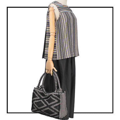 HOBO BLACK IN BLACK WITH BLACK BASE ON MODEL FOR PROPORTIONS The best eco luxury bags and accessories brand. Stylish clothes and Eco-Friendly with recycled yarns