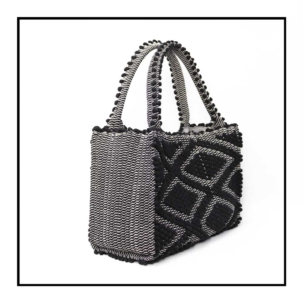 side view for HOBO BLACK IN BLACK WITH BLACK BASE The best eco luxury bags and accessories brand. Stylish clothes and Eco-Friendly with recycled yarns