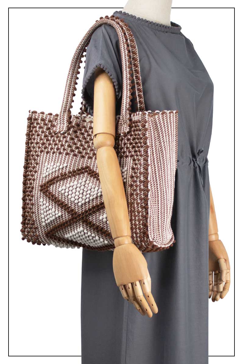 CHOC and CREAM medium tote bag on model large view to complete your look with our selection of accessories crafted with the environment in mind