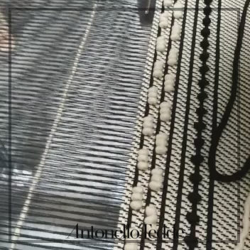 the weaving of the Urtei Medium Sustainable Tote Bag in Handwoven Coral and Cream Cotton with Iconic Rombetti Pattern - Eco-Friendly Artisanal Design by Antonello Tedde