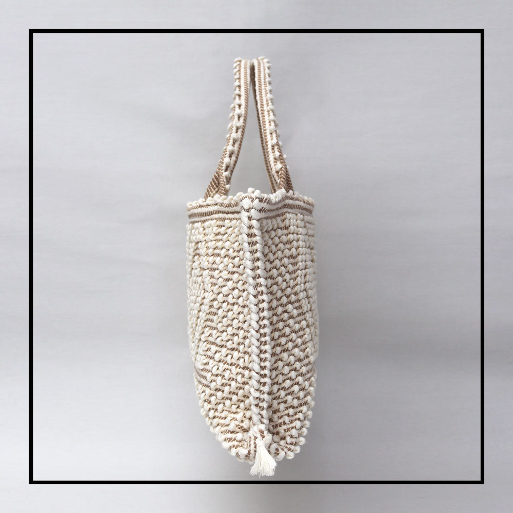 side view Medium tote bag cream base chestnut Ethical and Sustainable Handbags. The best eco luxury bags and accessories brand. Stylish clothes and Eco-Friendly with recycled yarns #luxury #ecoconcious #sustainablestyle #ethicalbrands #ethicalhandbags #handbags #sustainablelifestyle #ethicalfashion #sustainability