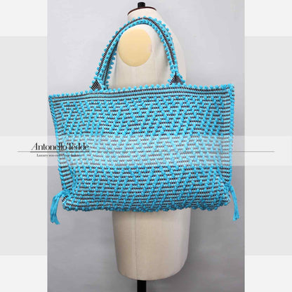 Capriccioli Medium zig zag- The bag is made using authentic Sardinian hand weaving methods in ethically managed factories. This tote bag is extraordinary and evokes faraway cultures with a contemporary touch, with focus on details such as colour, and material that are sustainable and eco-conscious