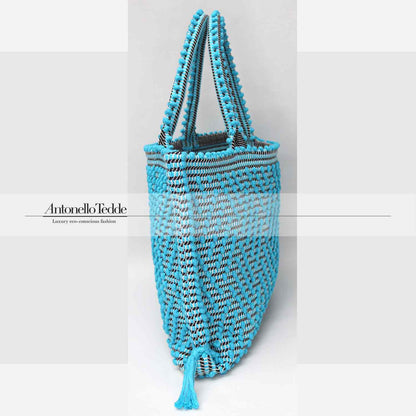 Capriccioli Medium zig zag- The bag is made using authentic Sardinian hand weaving methods in ethically managed factories. This tote bag is extraordinary and evokes faraway cultures with a contemporary touch, with focus on details such as colour, and material that are sustainable and eco-conscious