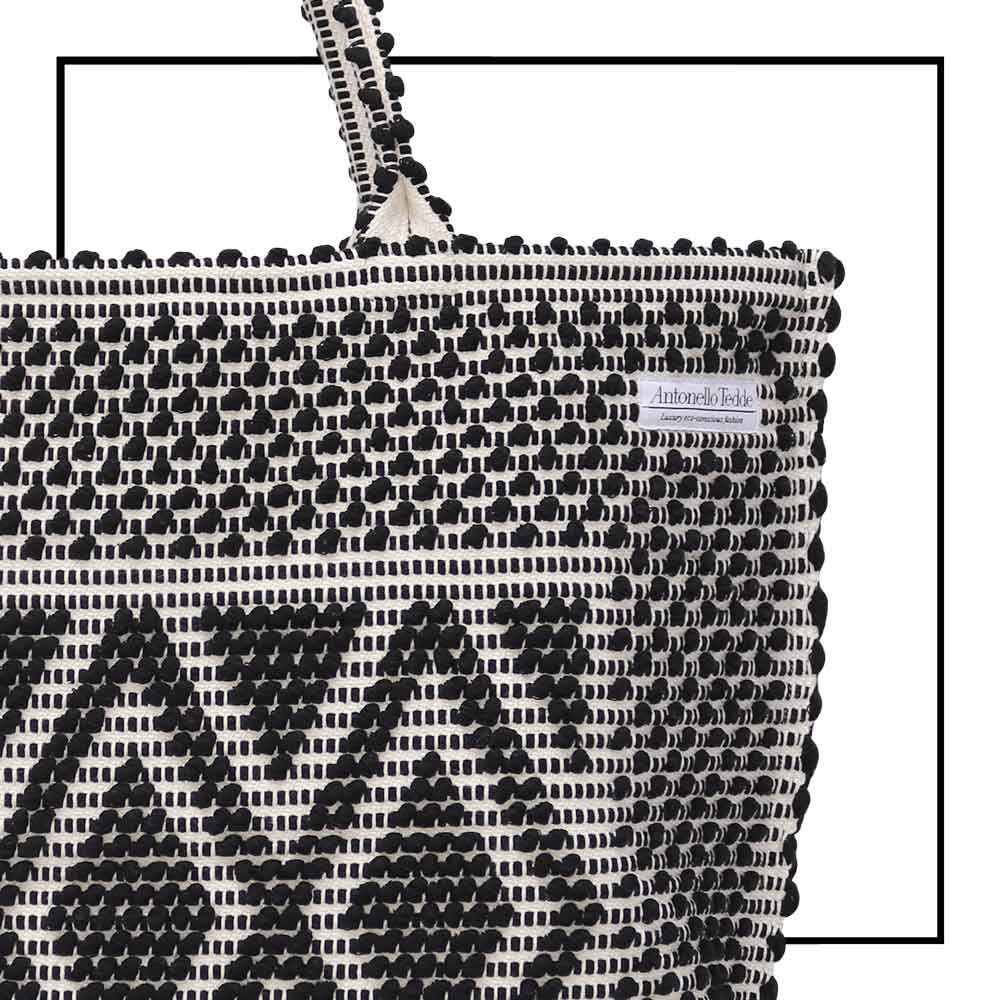 Capriccioli Large - The bag is made using authentic Sardinian hand weaving methods in ethically managed factories. This tote bag is extraordinary and evokes faraway cultures with a contemporary touch, with focus on details such as colour, and material that are sustainable and eco-consciou