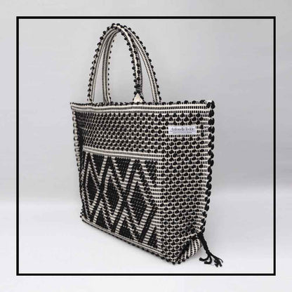 Capriccioli Large - The bag is made using authentic Sardinian hand weaving methods in ethically managed factories. This tote bag is extraordinary and evokes faraway cultures with a contemporary touch, with focus on details such as colour, and material that are sustainable and eco-consciou