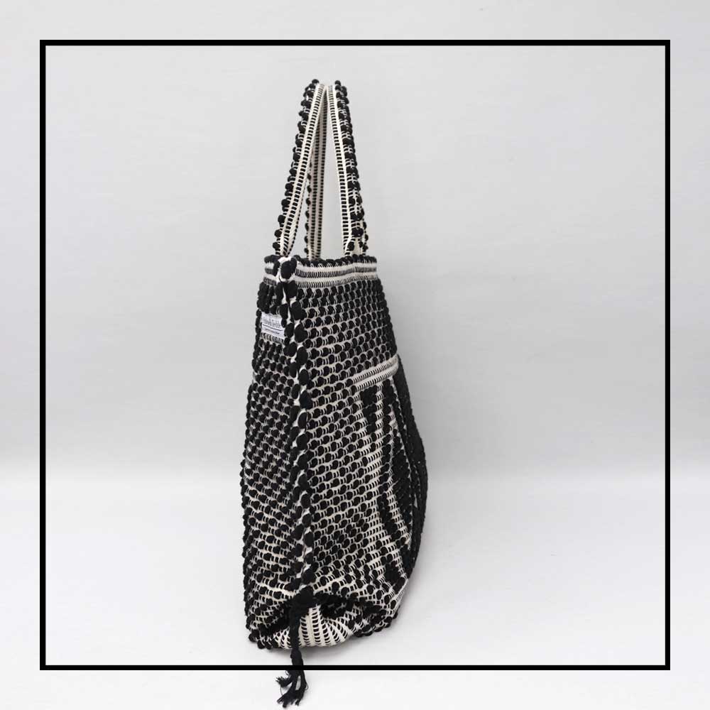 Capriccioli Large - The bag is made using authentic Sardinian hand weaving methods in ethically managed factories. This tote bag is extraordinary and evokes faraway cultures with a contemporary touch, with focus on details such as colour, and material that are sustainable and eco-conscious
