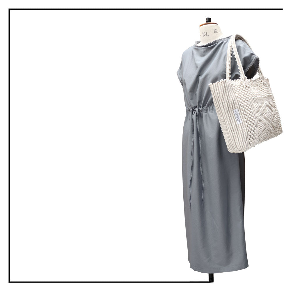Antonello Tedde tote bag is made using hand woven fabrics Made of Italian Linen and regenerated Cotton , it is unlined with a practical inner pocket and a diamond pattern. A magnet fastens the bag keeping it secure. The bag is made using authentic Sardinian hand weaving methods in ethically managed factories. 