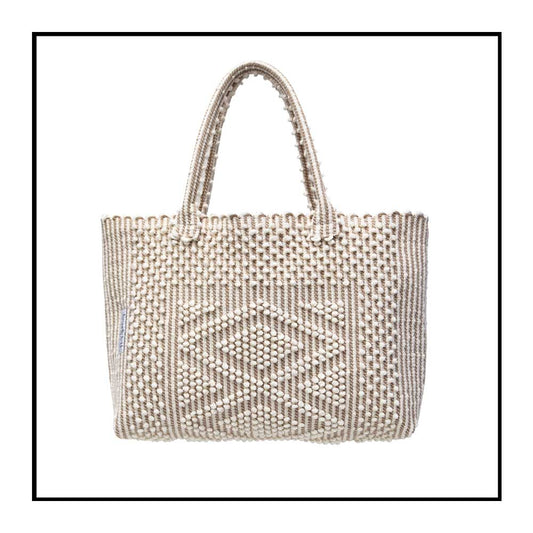 Antonello Tedde tote bag is made using hand woven fabrics Made of Italian Linen and regenerated Cotton , it is unlined with a practical inner pocket and a diamond pattern. A magnet fastens the bag keeping it secure. The bag is made using authentic Sardinian hand weaving methods in ethically managed factories. 