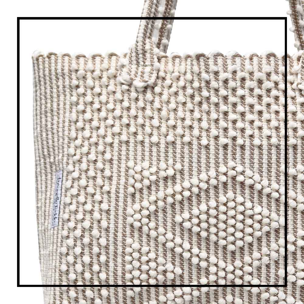 Antonello Tedde tote bag is made using hand woven fabrics Made of Italian Linen and regenerated Cotton , it is unlined with a practical inner pocket and a diamond pattern. A magnet fastens the bag keeping it secure. The bag is made using authentic Sardinian hand weaving methods in ethically managed factories. 