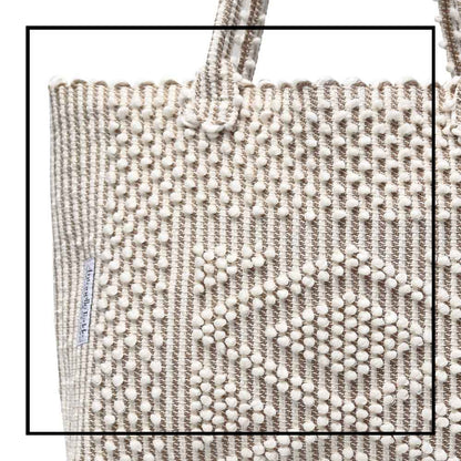 Antonello Tedde tote bag is made using hand woven fabrics Made of Italian Linen and regenerated Cotton , it is unlined with a practical inner pocket and a diamond pattern. A magnet fastens the bag keeping it secure. The bag is made using authentic Sardinian hand weaving methods in ethically managed factories. 